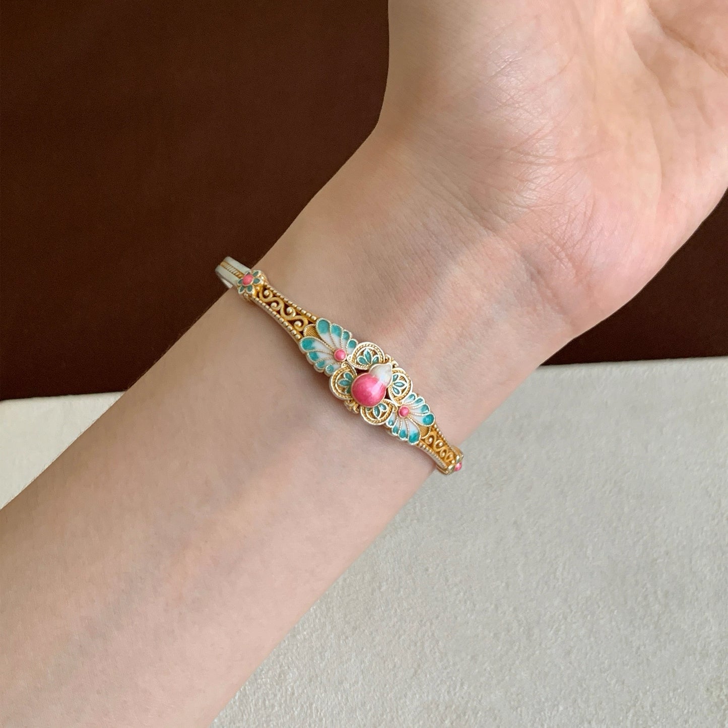 Handmade bracelet blending filigree and enamel that blooms with intricate floral patterns — a wearable garden of eastern elegance.