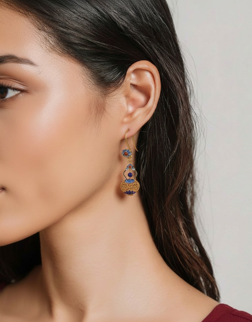 Handcrafted filigree silver earrings featuring gourd motif — meticulous detail that carries blessings of luck and prosperity.