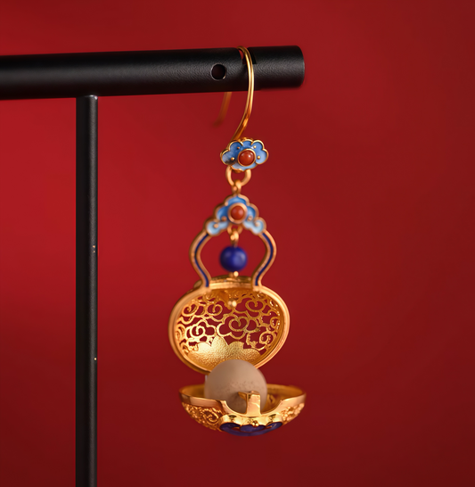 Handcrafted filigree silver earrings featuring gourd motif — meticulous detail that carries blessings of luck and prosperity.