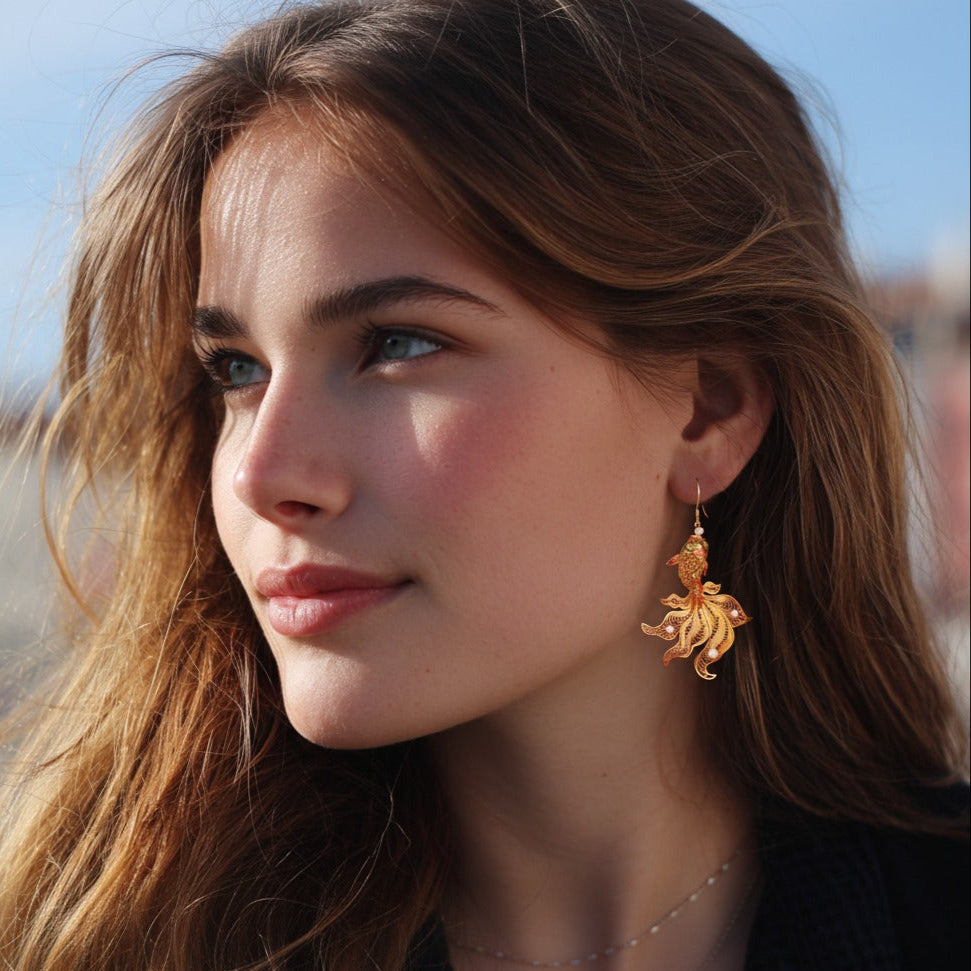 Handmade silver stud earrings depicting koi fish in intricate filigree — symbolizing luck, courage, and prosperity.