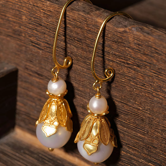 Handmade silver earrings featuring natural pearls set in delicate filigree — lightweight and elegant, perfect for everyday wear or gifting.