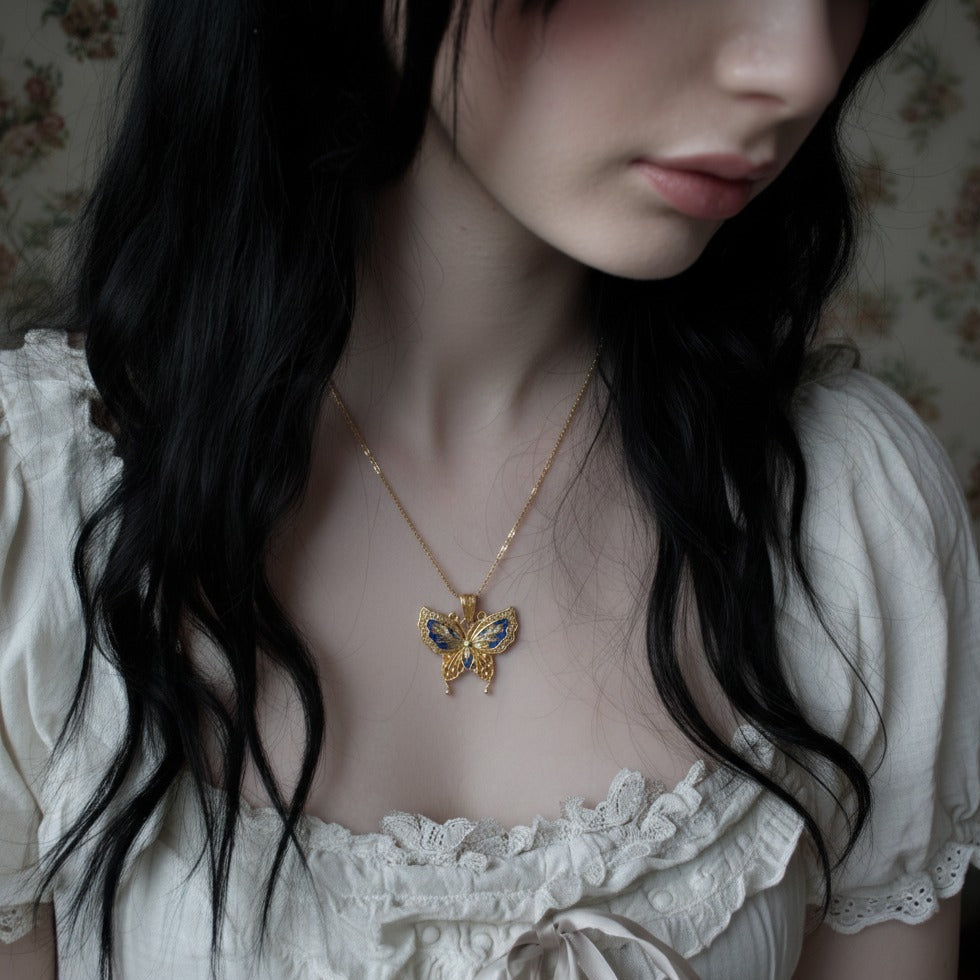 Butterfly pendant combining hollow silverwork and colorful enamel — a graceful Chinese enamel jewelry piece symbolizing transformation.
