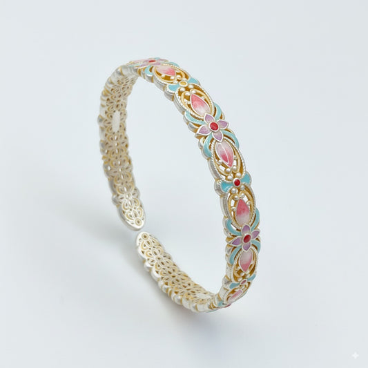 Handmade bracelet using filigree and enamel techniques, blooming with intricate floral patterns — a piece of Chinese enamel jewelry.
