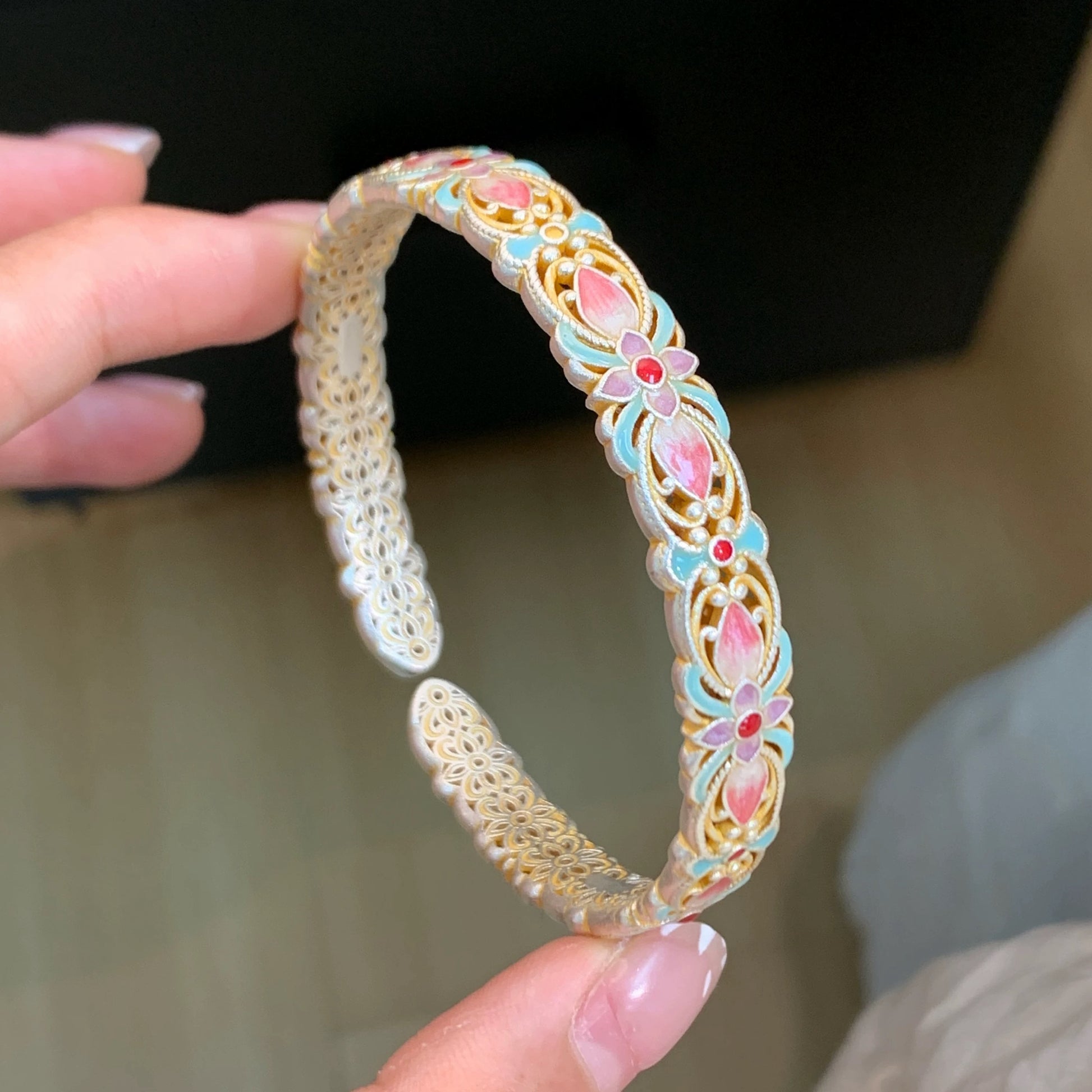 Handmade bracelet using filigree and enamel techniques, blooming with intricate floral patterns — a piece of Chinese enamel jewelry.
