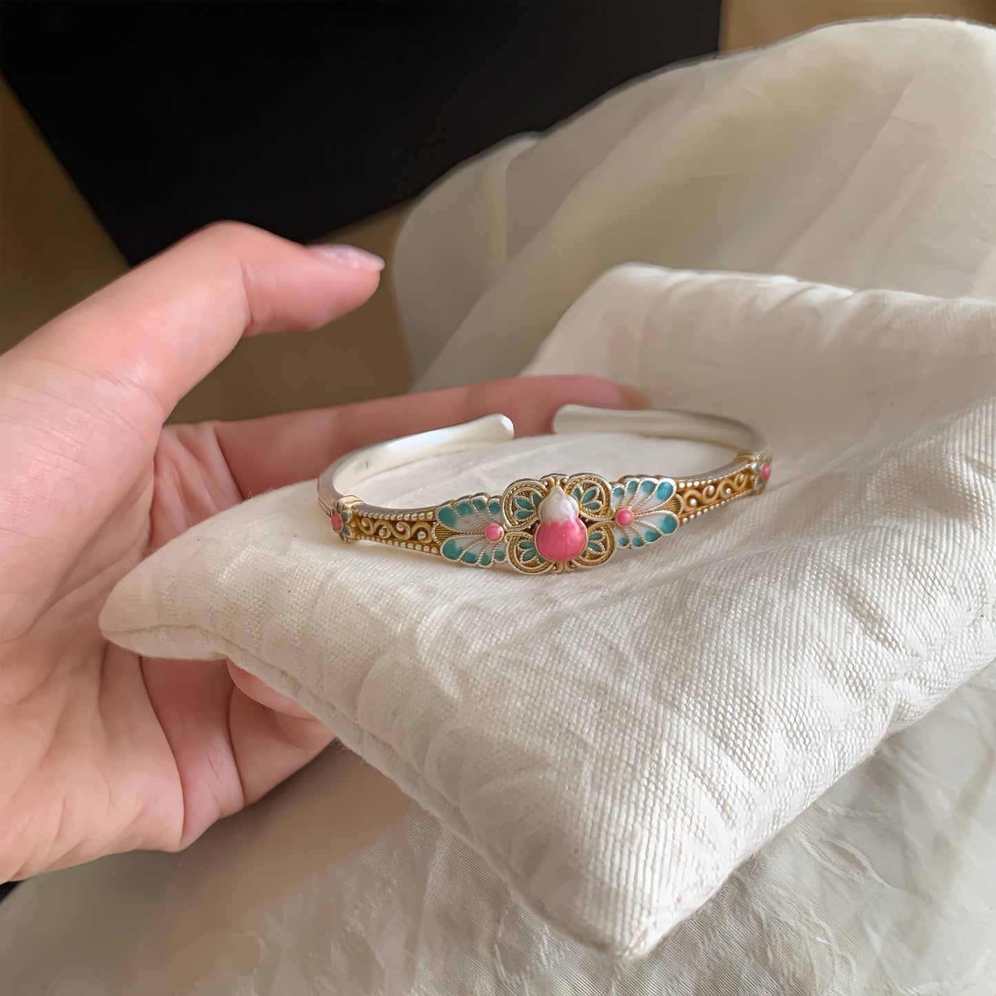 Handmade bracelet blending filigree and enamel that blooms with intricate floral patterns — a wearable garden of eastern elegance.
