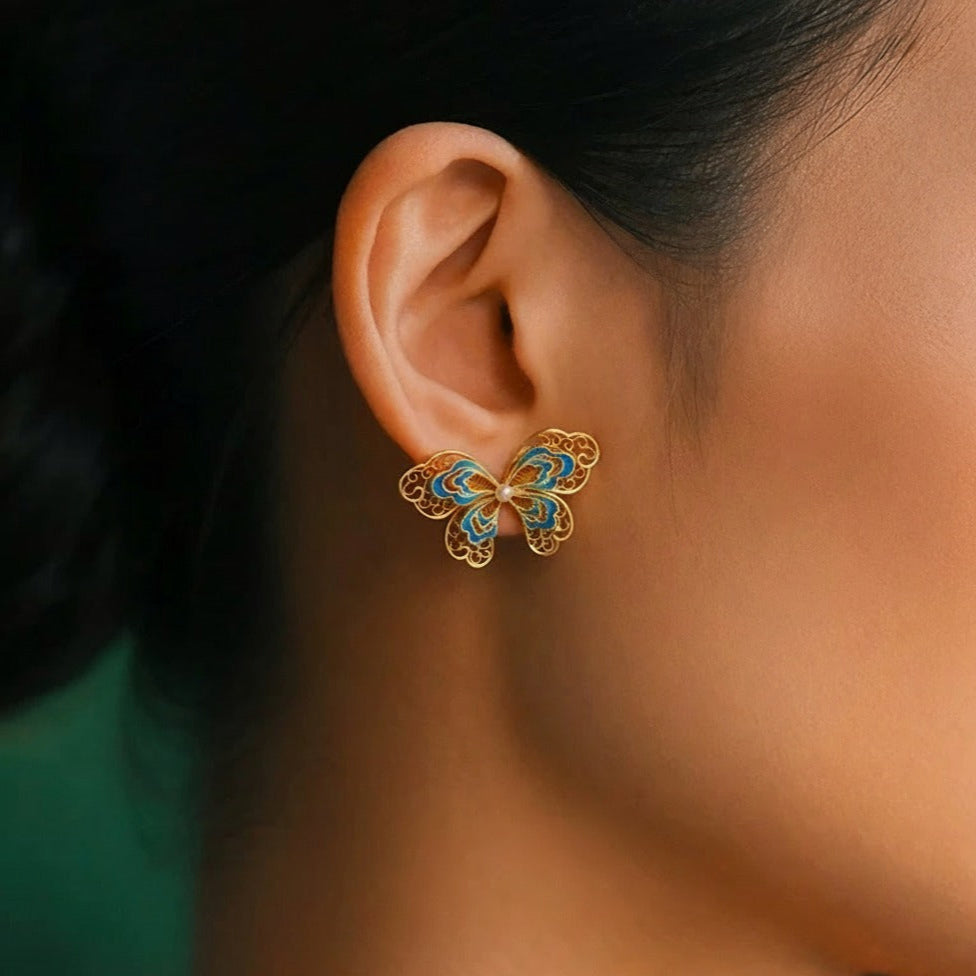 Gold-plated silver butterfly earrings crafted with filigree inlay, handmade jewelry symbolizing freedom and beauty in an oriental aesthetic.