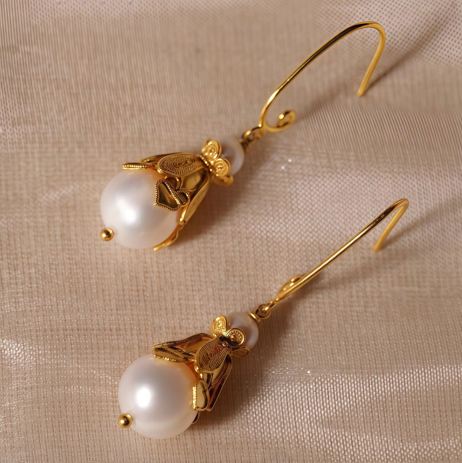 Handmade silver earrings featuring natural pearls set in delicate filigree — lightweight and elegant, perfect for everyday wear or gifting.
