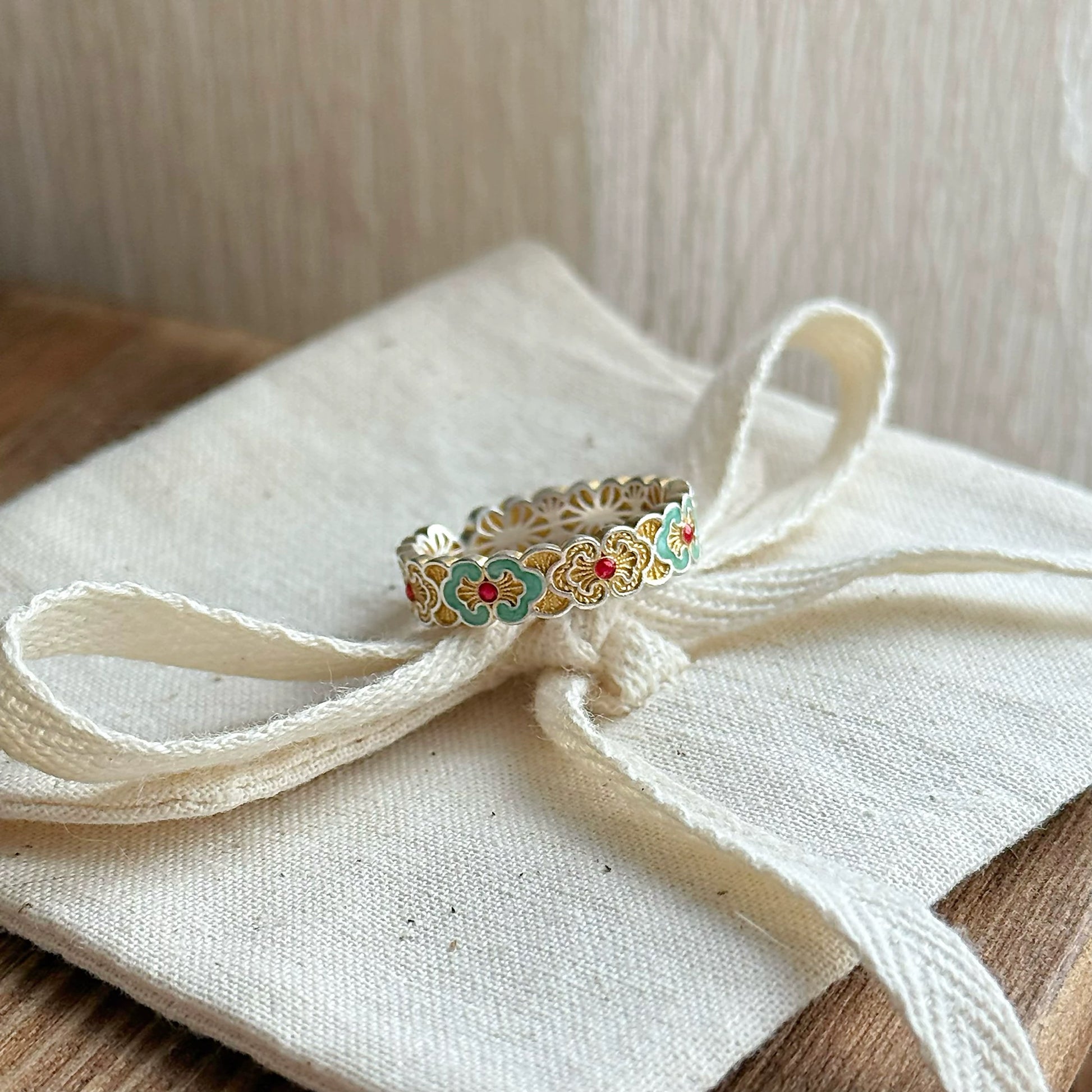 Sterling silver enamel ring inspired by delicate petals — combines enamel artistry with fine handmade silver craftsmanship, ideal with enamel earrings.
